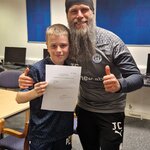 Image of Y7 student signs a 2 year  contract for Wigan Athletic